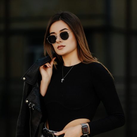 cropped-young-woman-sunglasses-hat-black-leather-jacket-posing-outdoor-scaled-2.jpg